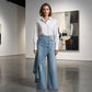 Asymmetrische Wickeljeans 👖 Eine Kombination aus Culottes und Hose, hochgeschnitten für optisch längere Beine, weit geschnitten und fließend, mit diagonal angeordneten Knöpfen – im Handumdrehen zur Fashionista! ✨