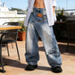 👖✨ 50% RABATT! Damen Jeans mit asymmetrischem Bund und weitem Bein – lässiger Oversize-Look mit Statement-Detail